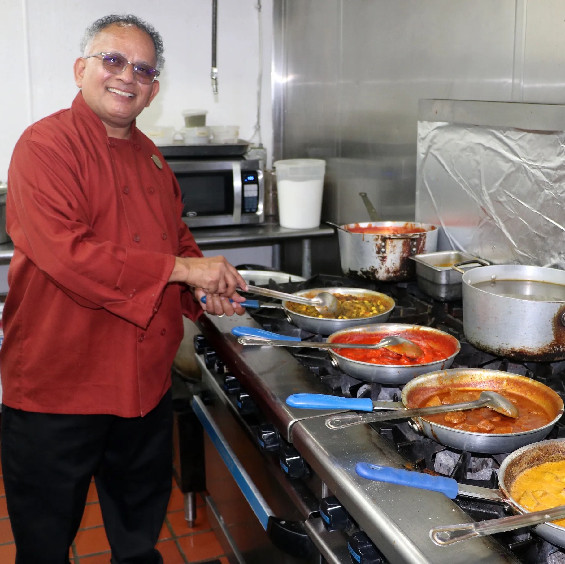 Guru Restaurant Chef Uday Kadam cooking up delicious dishes